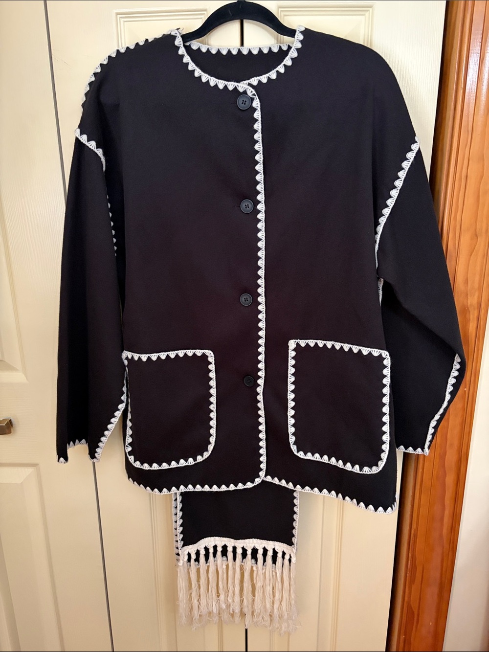 Black Women's Button-Front Coat with White Trim and Fringe/Scarf